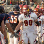 Paul Slaats '17, CMS football player greets opponents