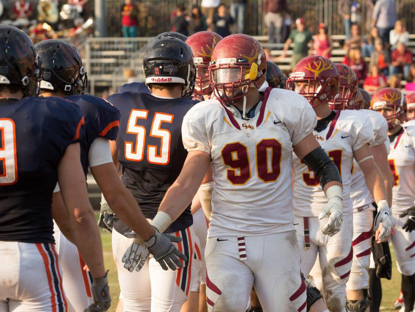 Paul Slaats '17, CMS football player greets opponents