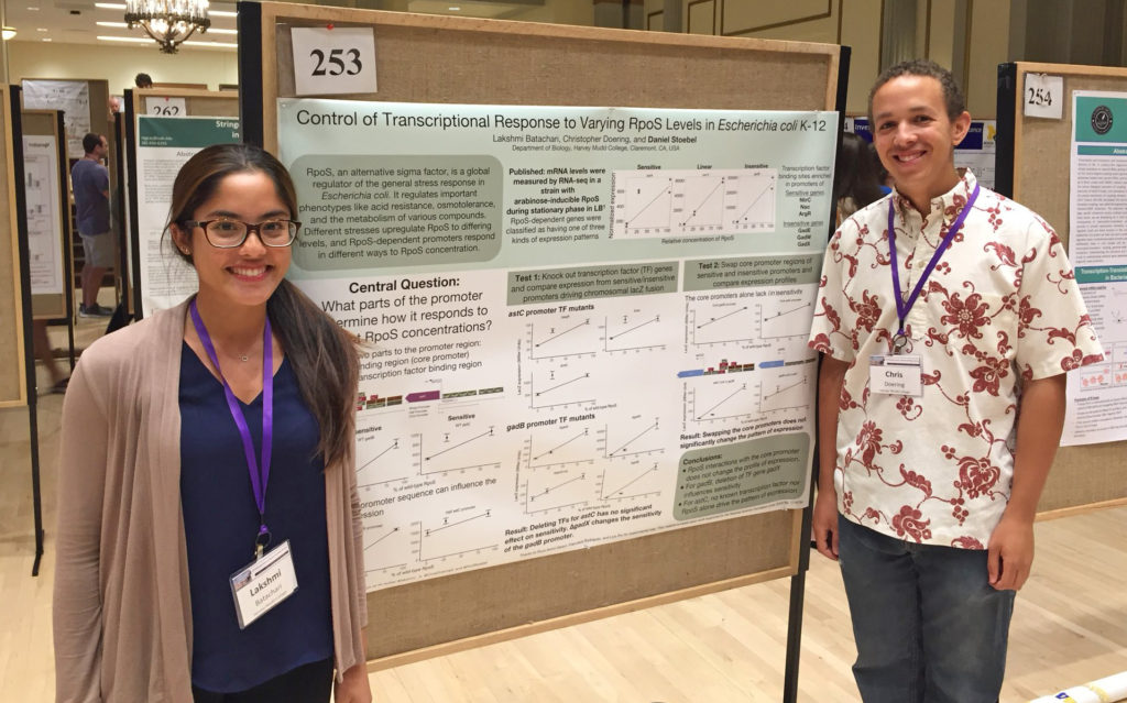 Harvey Mudd chemistry and biology students Lakshmi Batachari ’18 and Chris Doering ’19 pose next to their winning Undergraduate Research poster at the 2018 Molecular Genetics of Bacteria and Phages meeting.
