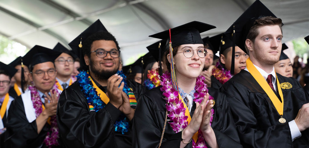 Graduates clapping