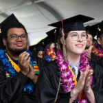 Graduates clapping