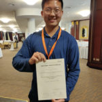 Julius Lauw with the award for best paper.