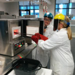 students pulling samples from a furnace