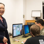 Weiqing Gu and students in classroom