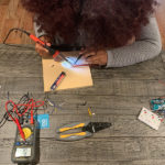 Hillary Rodriguez '21 builds a remote sensor to collect air quality data as part of the CEHAT CS Clinic.
