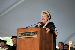 Maria Klawe at podium in doctoral robes.