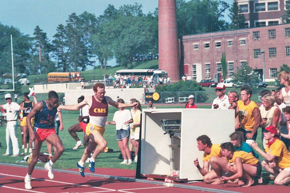 Tony Gnecco running on racetrack.