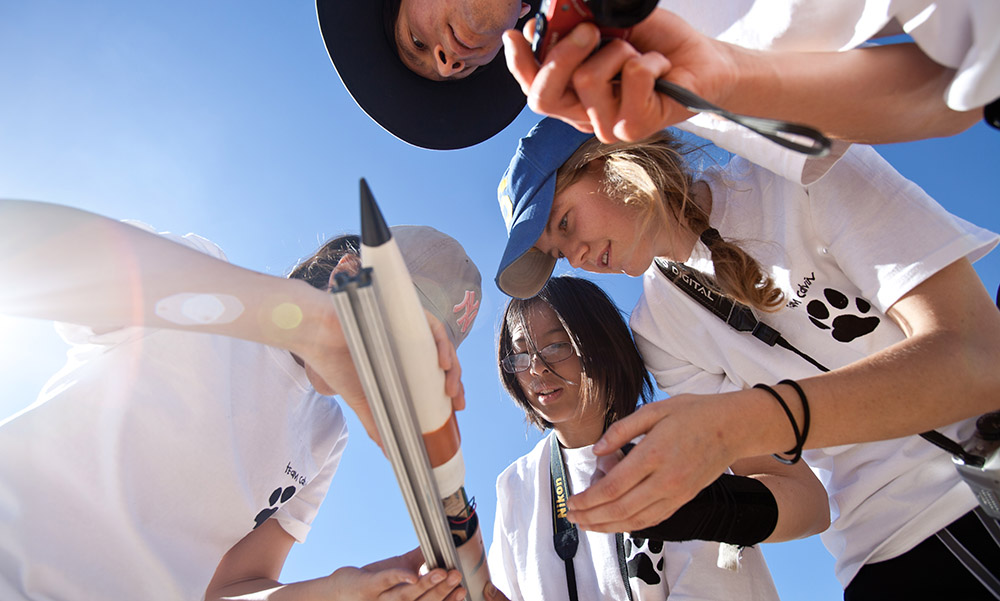 students working on rocket