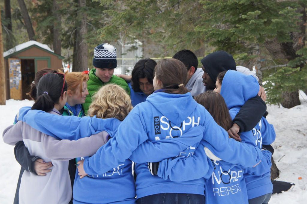 Sophomore Retreat participants stand in a circle.