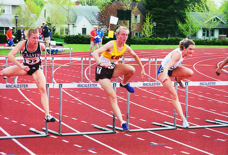 Track and field alumna Katie Ray, Class of 2002, jumps hurdles for CMS