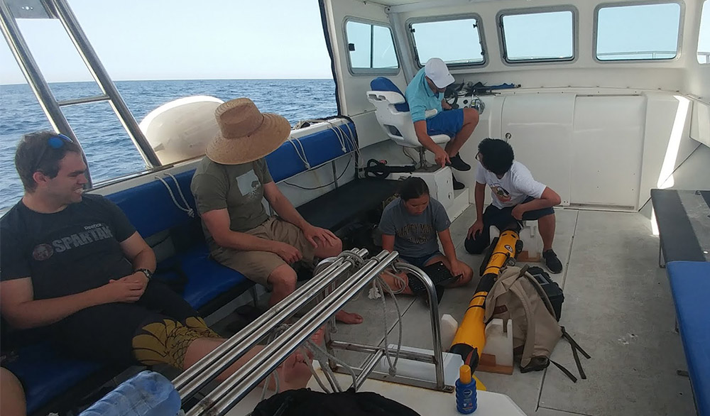 students with AUV in boat