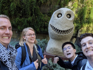 Students pose with statue