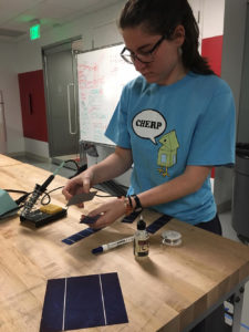 student working with solar panel