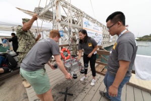 students carrying AUV