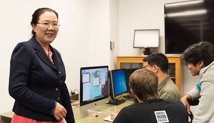 Weiqing Gu and students in classroom