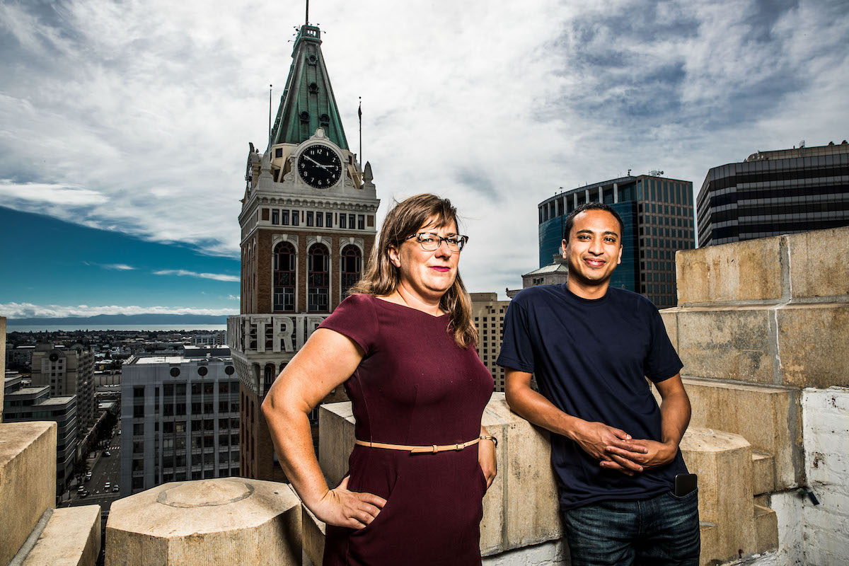 Edith Harbaugh and John Kodumal atop a tall building