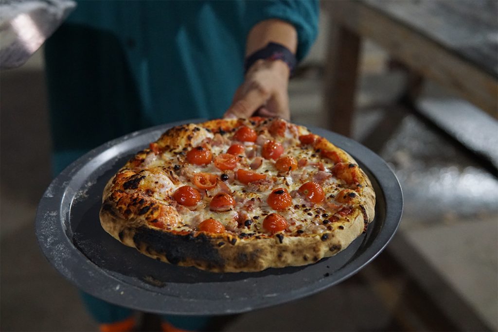 Pizza with cheese and tomatoes.