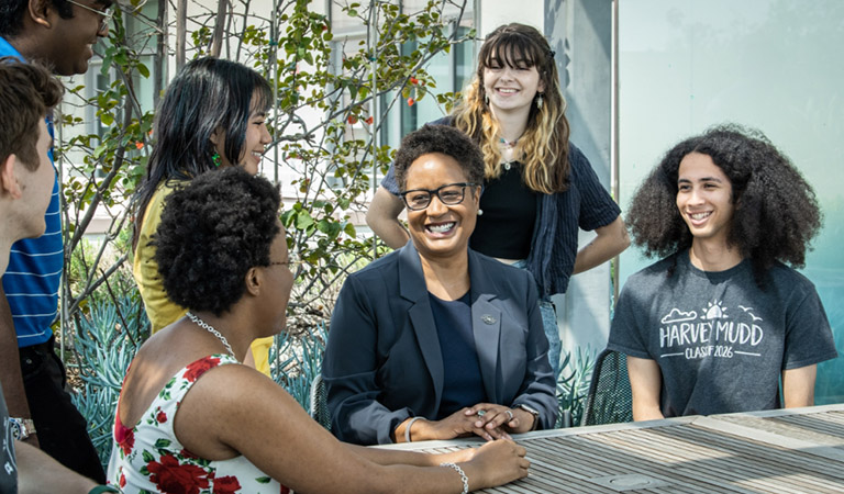 President Harriet Nembhard speaking with students.