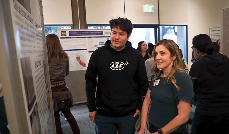 Visitors read about the on-going projects during the Voices of Engagement event.