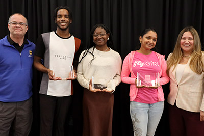 students standing with Dean Chris and Dean Cindy