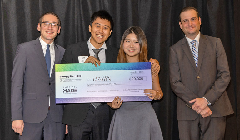 Harvey Mudd students posing with EnergyTech Award check and with Anthony Pugliese (right, DOE Chief Commercialization Officer) and Justin Bis (left, DOE Office of Tech Commercialization Chief of Staff). Photo by Agata Bogucka _ NREL
