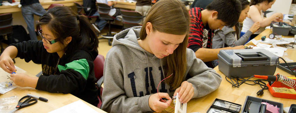 students working on robot cars