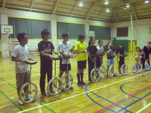 Harvey Mudd Watson Fellow Srisuknimit in Japan with the team that did figure unicycling.