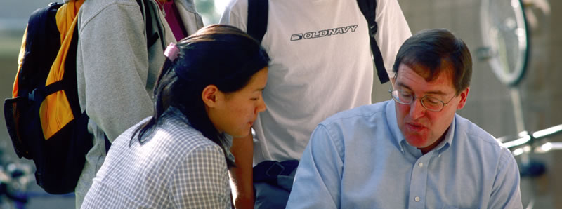 Students talking with a professor