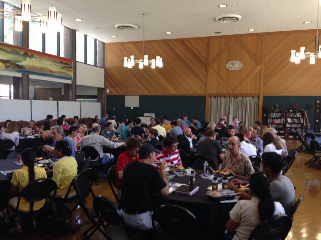 Prospective students and their families chat with current students and faculty members during lunch at the Platt Campus Center.