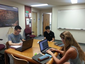 The table at the junction of the Physics and Chemistry Departments is a popular work spot amongst physics majors and freshman alike. Here, Jim Wu, Tim Middlemas, and Rachael Kretsch work on summer research. Prof. Cave's office door is open behind them (fun fact: Prof. Cave is a chemist, but his office is in the Physics Department. He was the one who converted me to physics, too!)