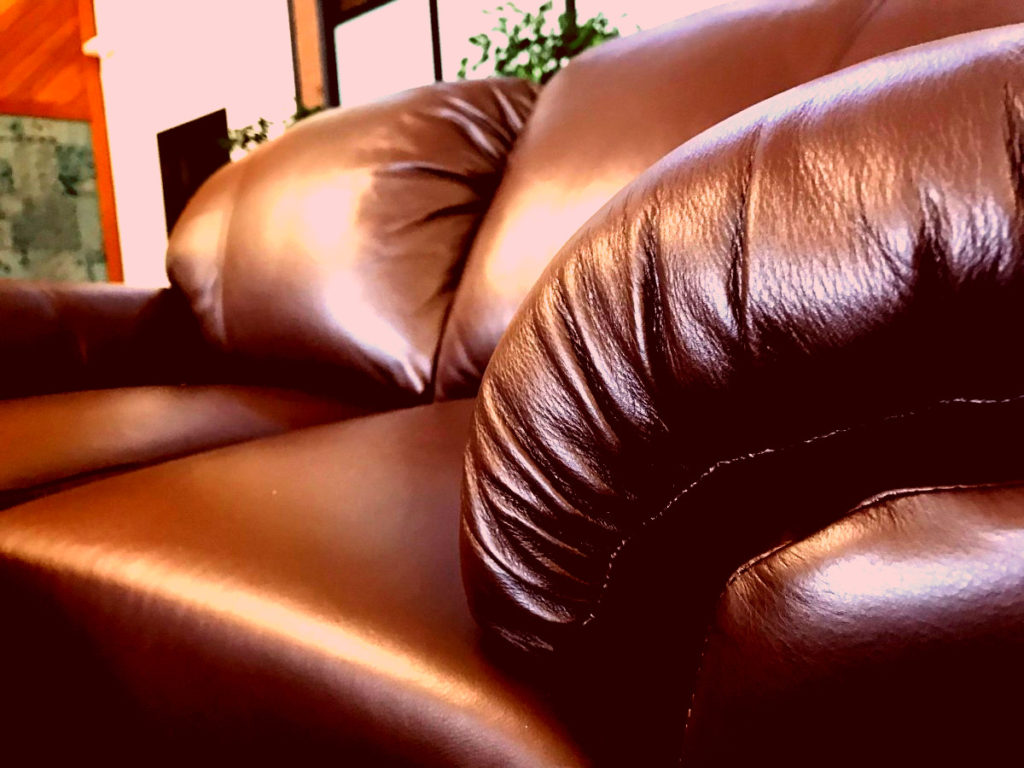 Red tinted close up of a new couch.