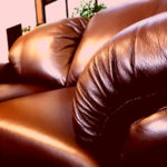 Red tinted close up of a new couch.