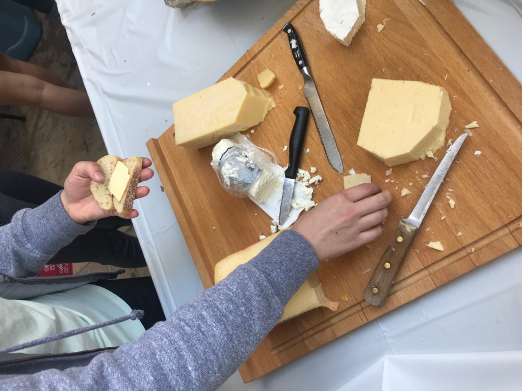 A picture of cheese on a cutting board.