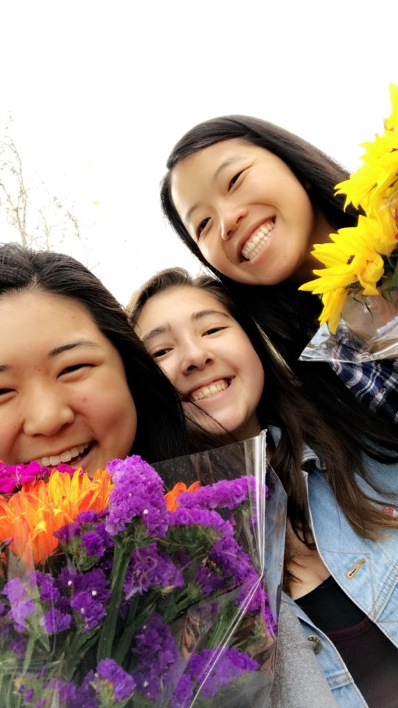 Julia and friends with flowers at the market 