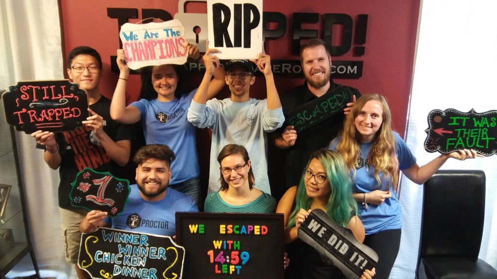 Several proctors celebrating winning an escape room