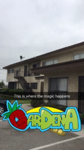 A photo of a tan building with a “Gardena” geotag. There is text on the image that says “This is where the magic happens.”