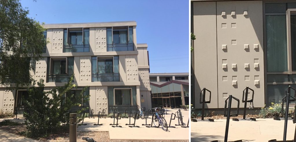 Left: A wall of a building. There are alternating windows and panels of raised and indented squares, called warts. Right: One panel of the wall has lots of raised and indented squares. If you read them as braille, they will spell “MUDD WART”