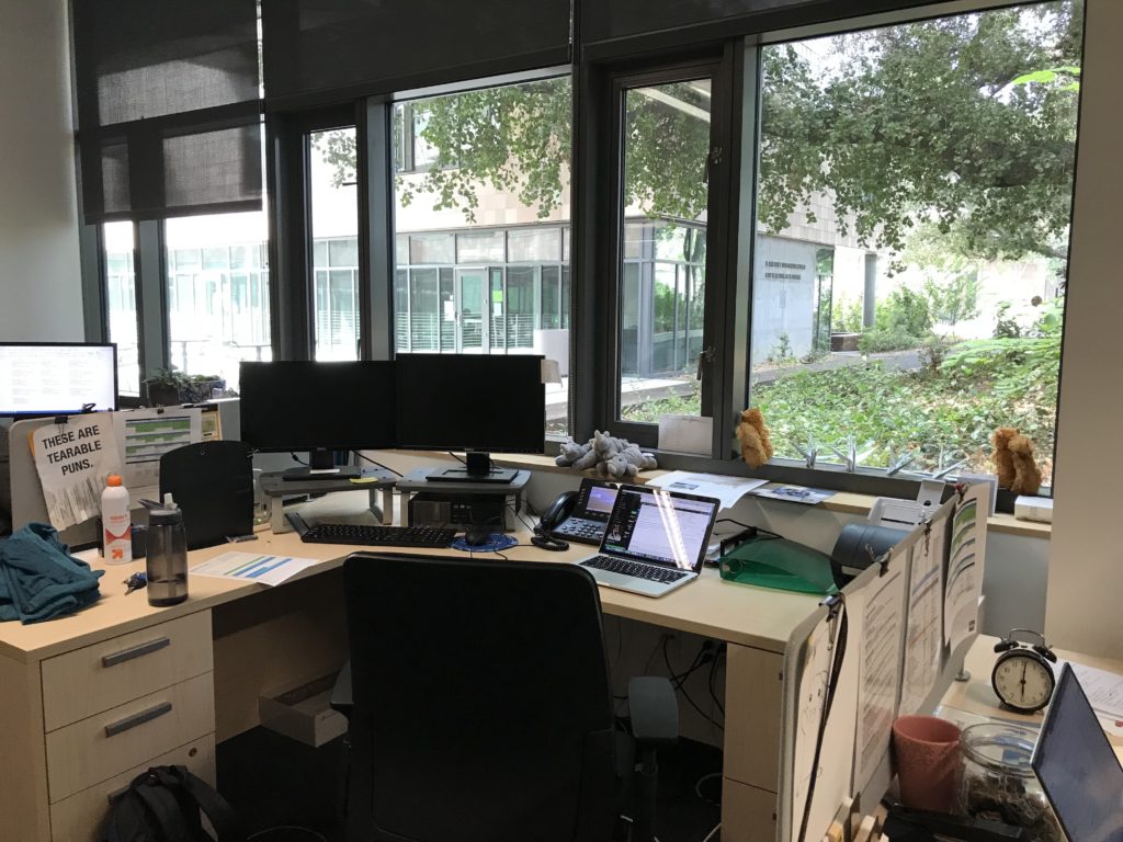 Desk in Admissions office with a view of the Founder's Classroom