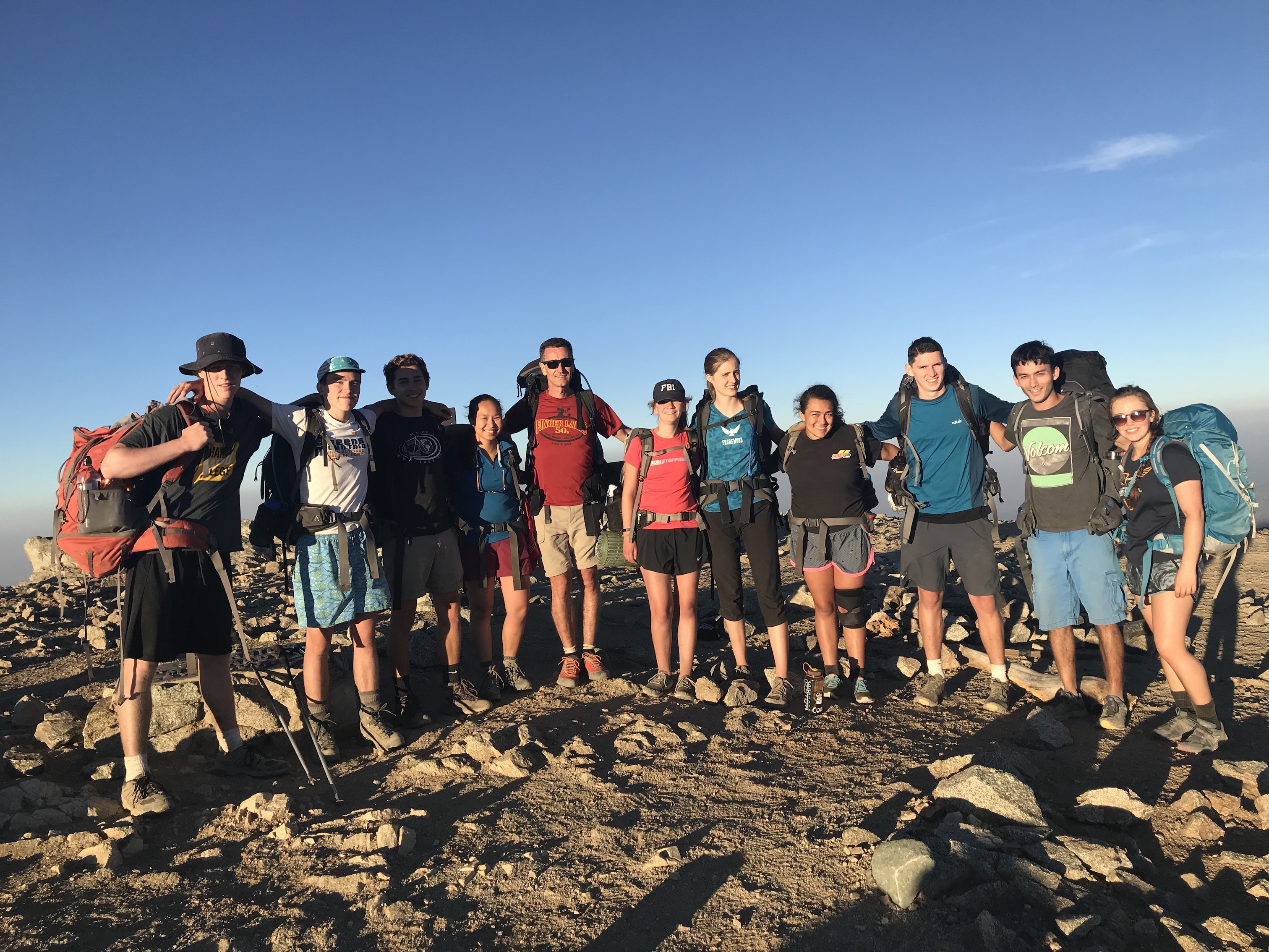 Smiling faces of my orientation group on top of baldy