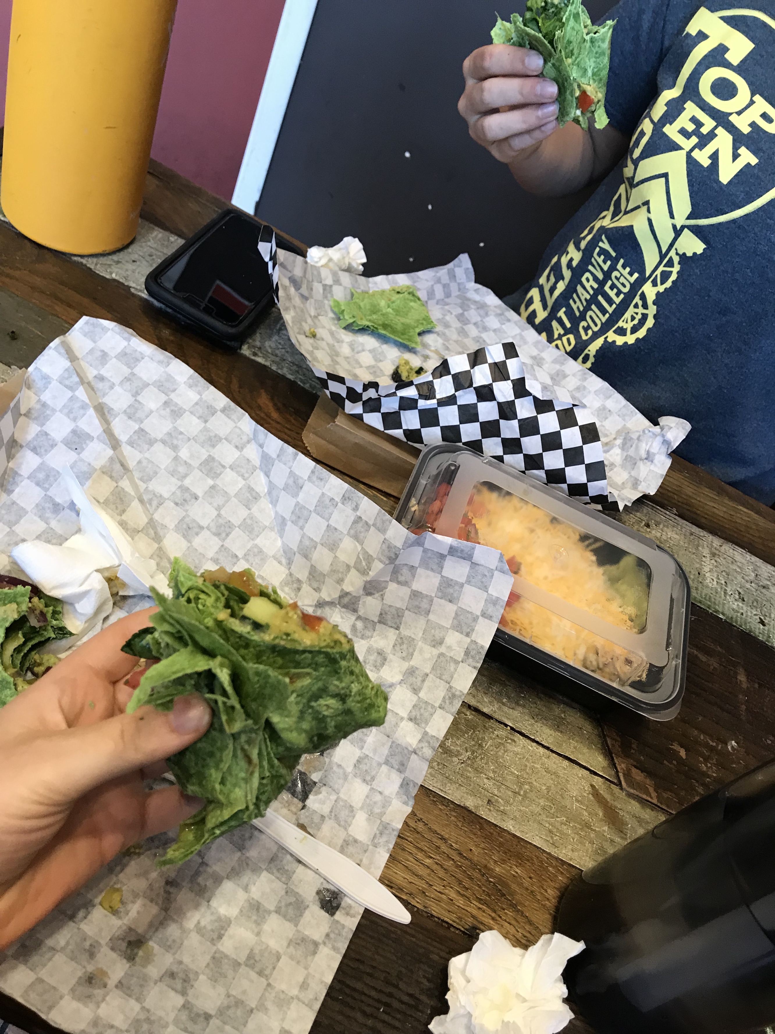 Katie and I holding our 75% eaten veggie wraps