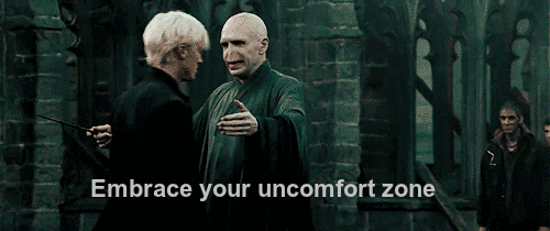A gif of a scene in a Harry Potter in which a bad guy is hugging a main character with the caption "Embrace your uncomfort zone".