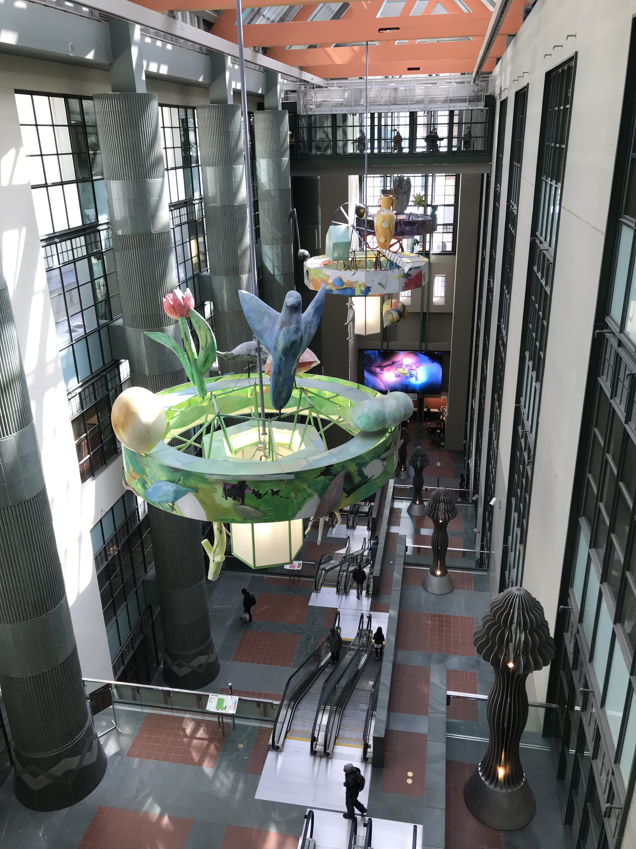 The inside of the LA Public Library has colorful chandeliers