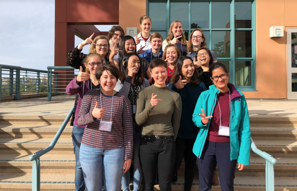 The women physics Mudders hold up the right hand rule