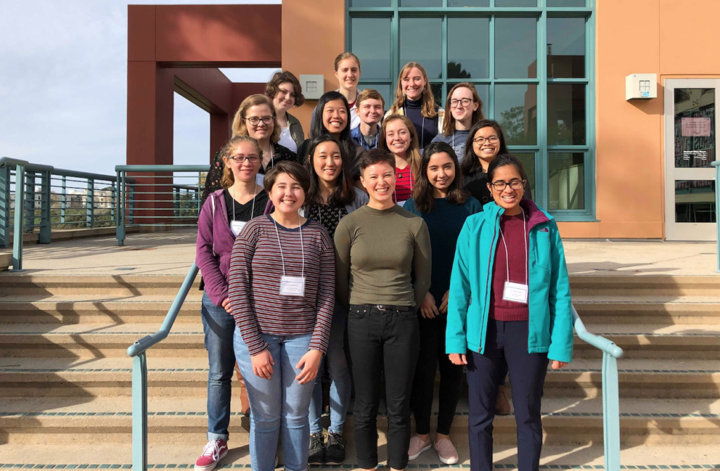 15 of the women physics majors stand and smile together at CUWiP