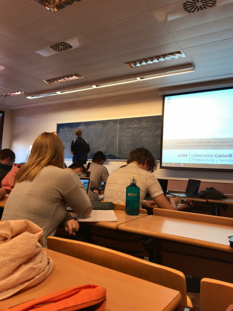 classroom with blackboard and projector screen
