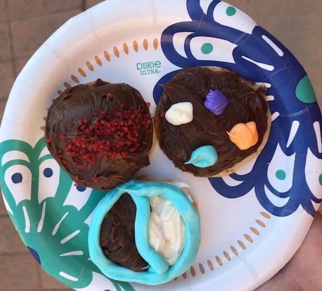 A plate with three cookies on it.
