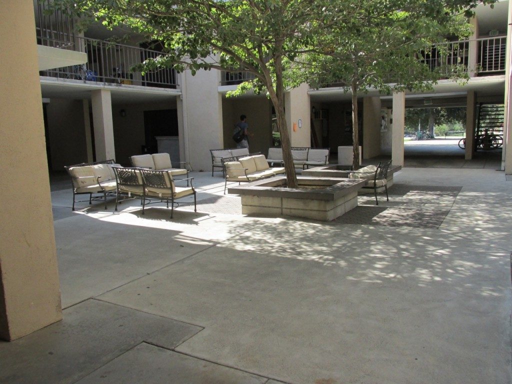 Empty courtyard with chairs and trees