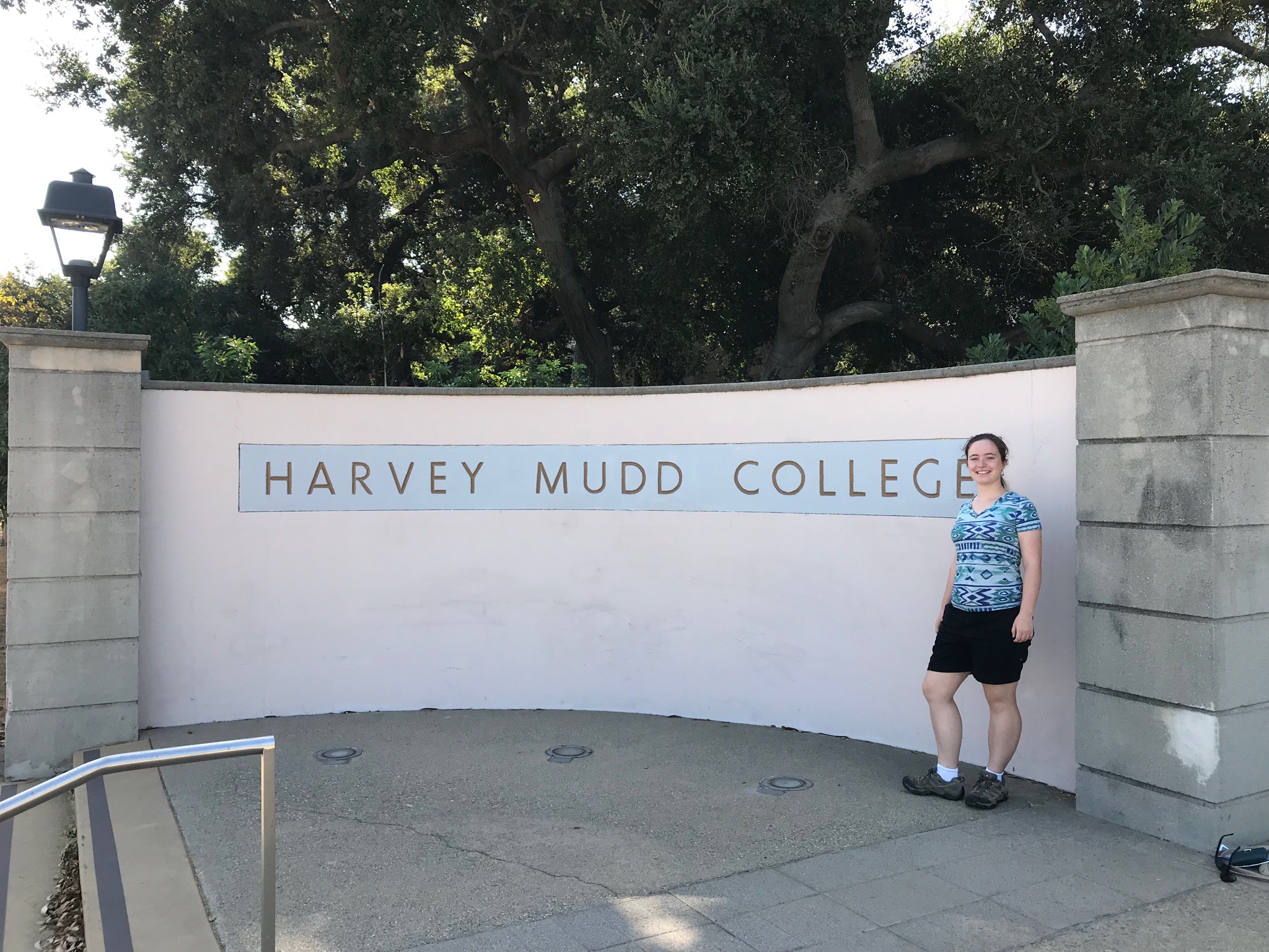 Malia in front of a Harvey Mudd College