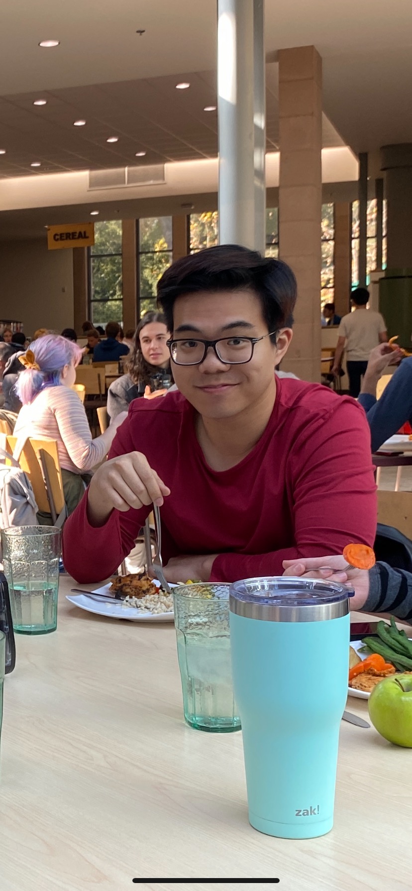 Jonathan sitting at a table in the Hoch