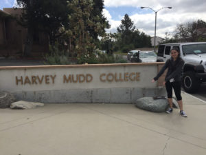 Alyssa poses in front of Harvey Mudd College sign.